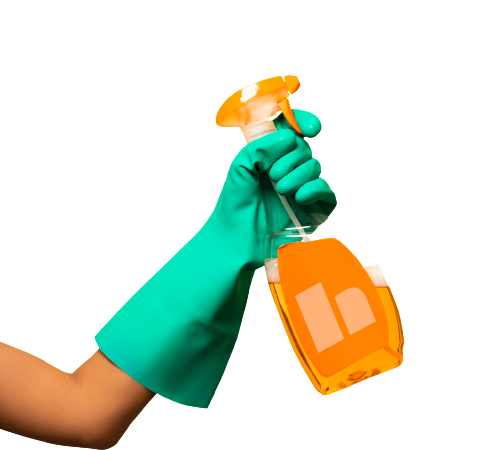 a hand in green gloves holds a bottle with cleaning chemicals